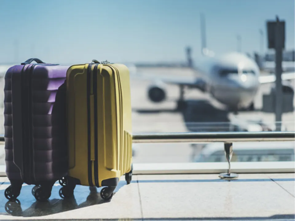 Airport with bags and airplane in background